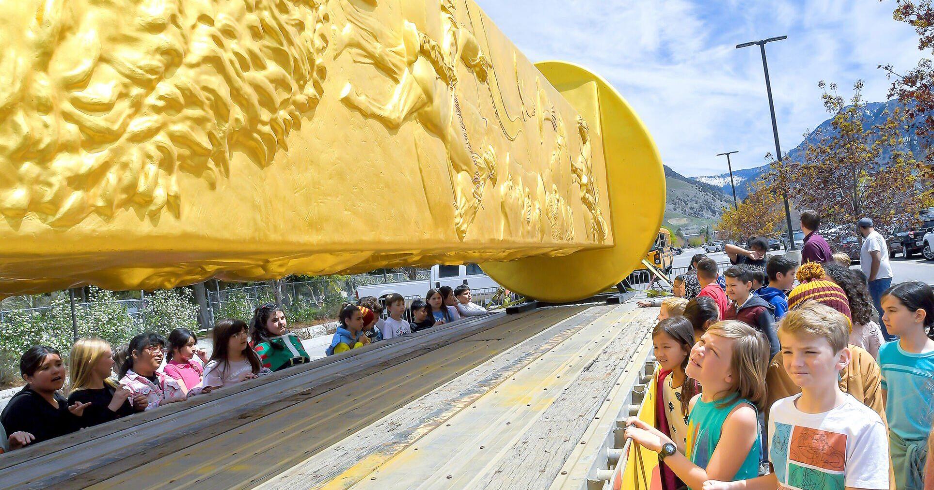 Giant golden railroad spike to honor transcontinental railroad workers visits USU - Vimarsana News