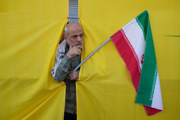 Iran stages massive Tehran rally as volunteers pledge to take up arms, in photos