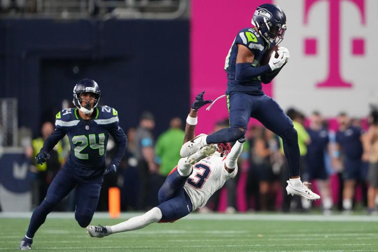 Photos of the NFL season opener, a rare Super Bowl rematch between the Seahawks and Patriots