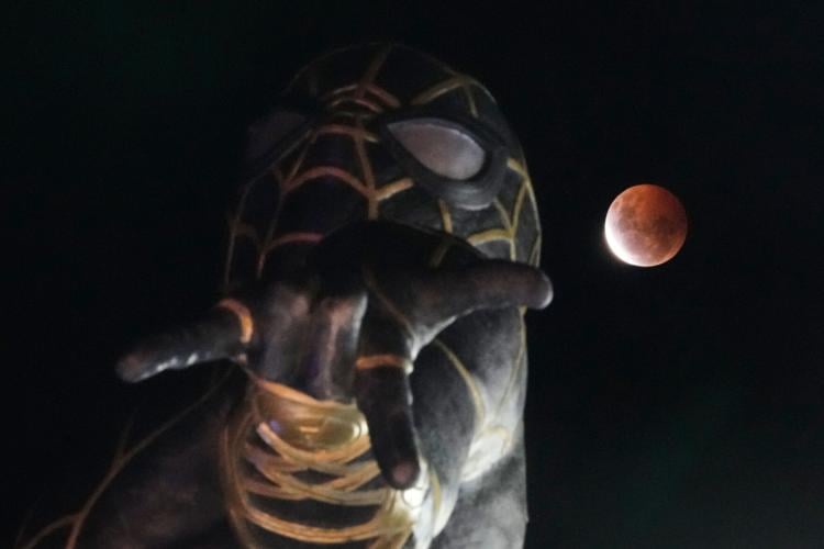 A lunar eclipse lights up skies across the Americas. in photos