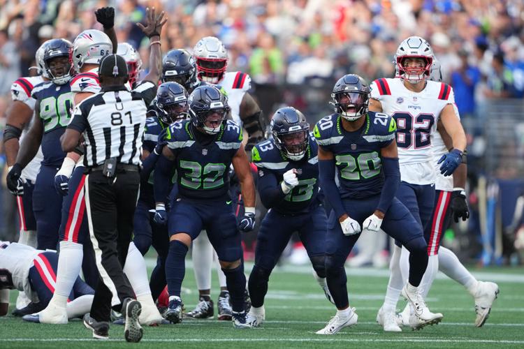Photos of the NFL season opener, a rare Super Bowl rematch between the Seahawks and Patriots