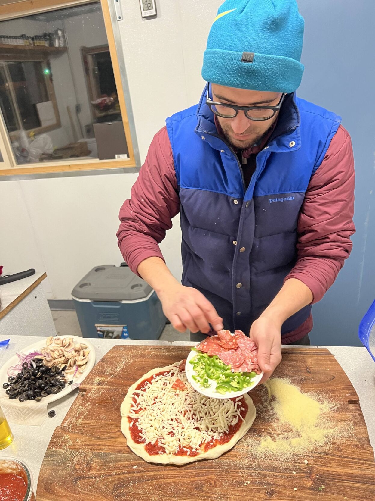 Gibril preparing pizza