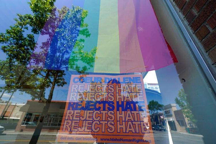 Rejecting hate sign in CdA AP photo