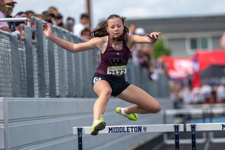 Ava Crouch hurdles to a 6th place finish in the 300 meter hurdles.jpg