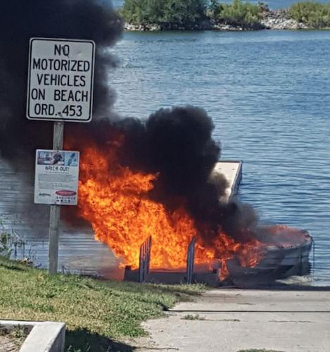 Boat and dock destroyed by fire