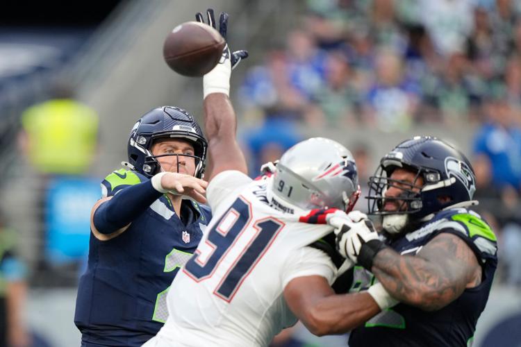 Photos of the NFL season opener, a rare Super Bowl rematch between the Seahawks and Patriots