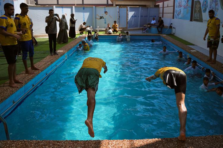 Palestinian children who lost limbs in the Israel-Hamas war learn to swim in Gaza