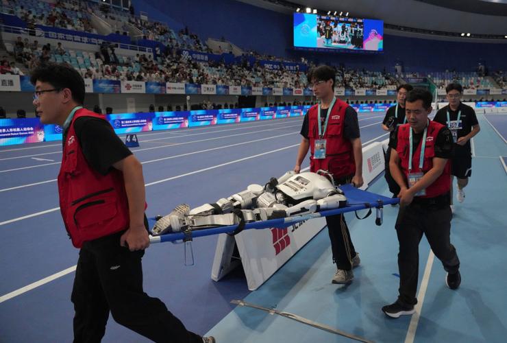 Humanoid robots sprint, play soccer and set records at Beijing games, in photos