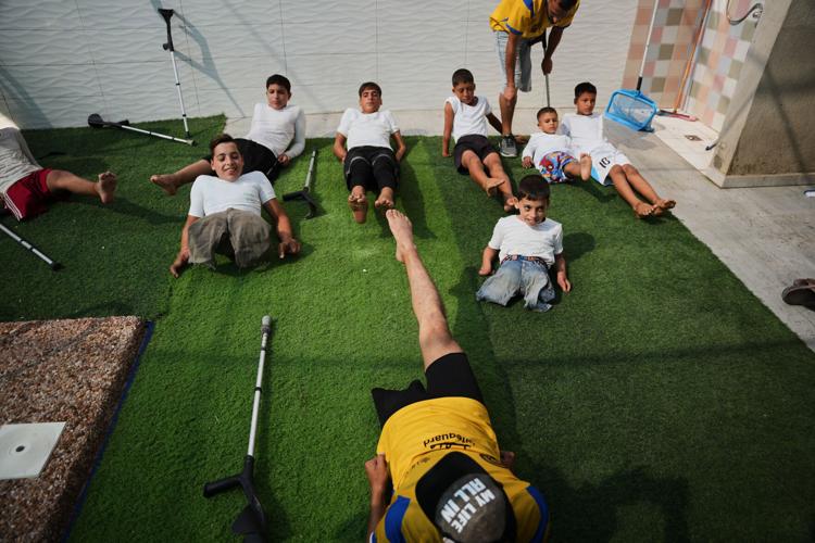 Palestinian children who lost limbs in the Israel-Hamas war learn to swim in Gaza