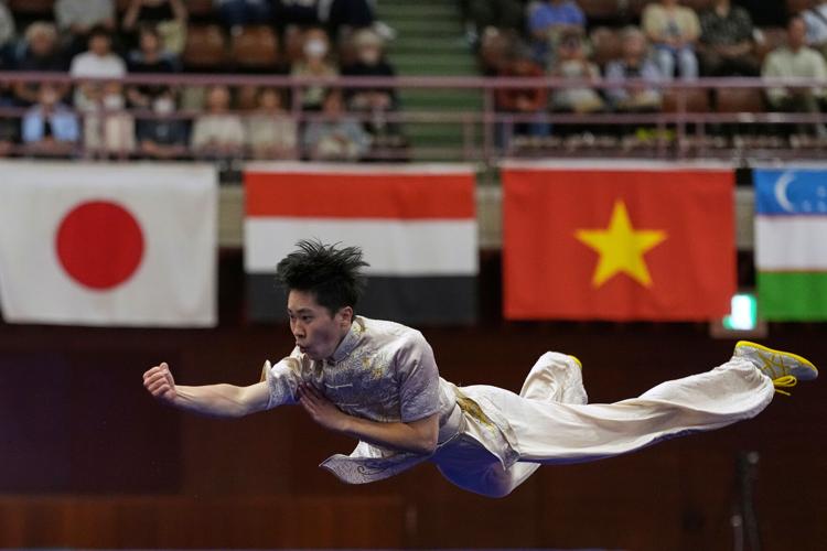 Photos of wushu athletes performing martial arts routines at the Asian Games
