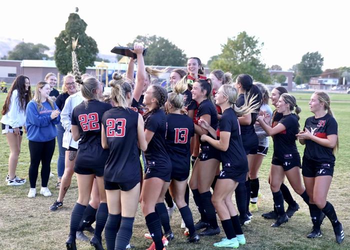 Highland girls soccer with trophy