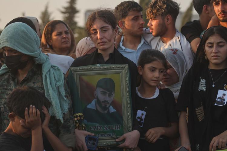 Photos of the funeral for victims of a deadly prison fire and riot in northern Syria