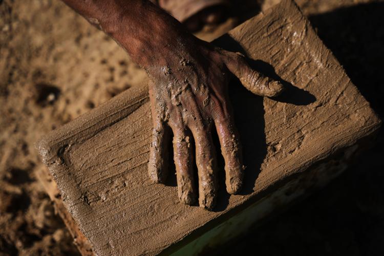 Photos show Palestinians using handmade mud bricks, wood and plastic to rebuild amid Gaza’s rubble