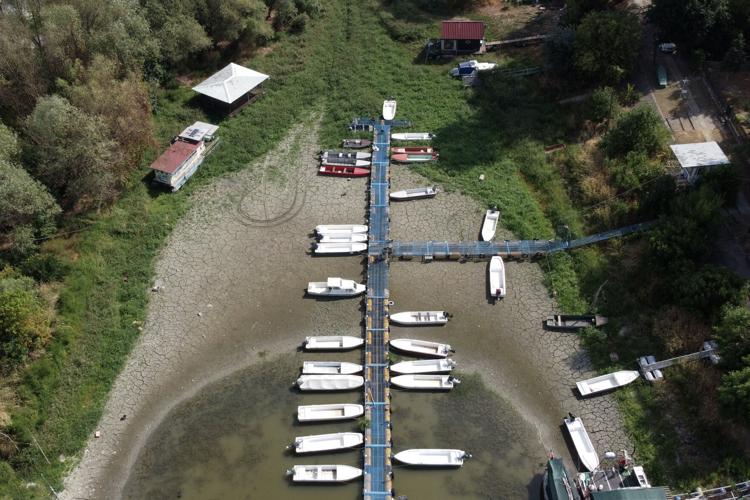 Photos show European fishers on the brink as summer drought parches rivers, lakes and farms