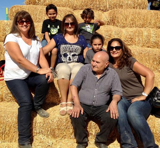 Ahmad Dolkhani sitting with family