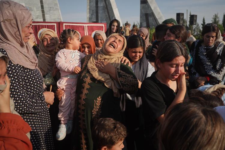 Photos of the funeral for victims of a deadly prison fire and riot in northern Syria