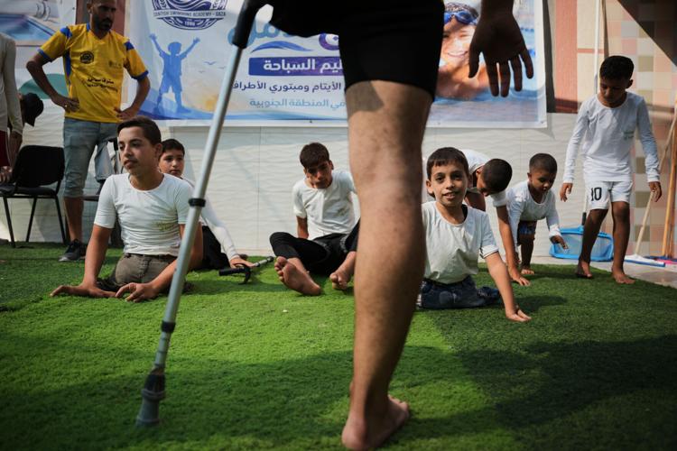 Palestinian children who lost limbs in the Israel-Hamas war learn to swim in Gaza