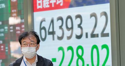 Asian shares retreat after strong profits lead a rally on Wall Street