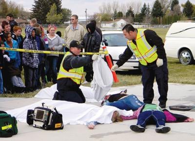 mock influence dangers driving under mountain idahostatejournal crash staged accident victims responders emergency middle bags friday during place body school