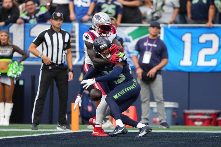 Photos of the NFL season opener, a rare Super Bowl rematch between the Seahawks and Patriots