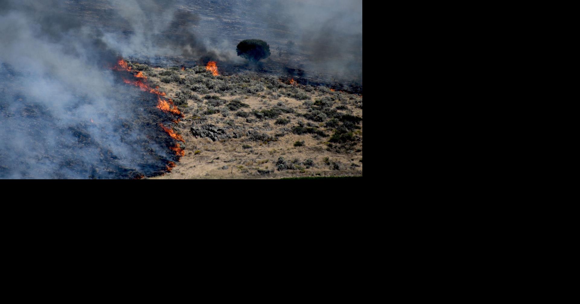 Firefighters and farmers battling 100-acre wildfire near Rexburg sparked by railroad bridge work