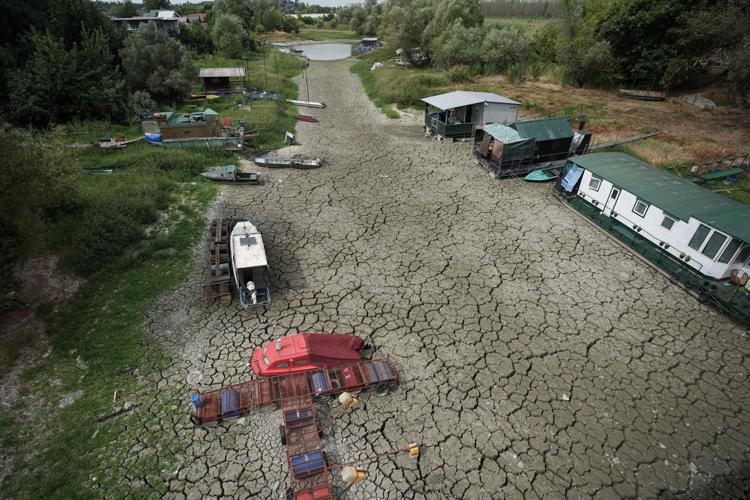 Photos show European fishers on the brink as summer drought parches rivers, lakes and farms