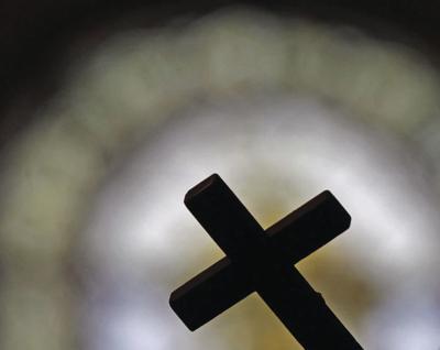 Cross in front of window