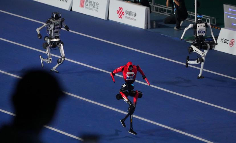 Humanoid robots sprint, play soccer and set records at Beijing games, in photos