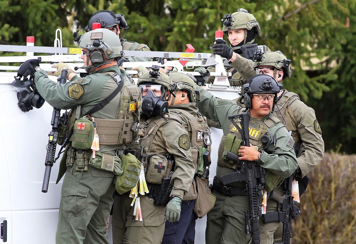 Three suspects charged in fatal shooting that led to standoff Local
