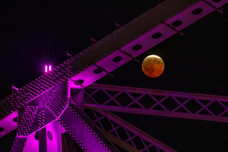 A lunar eclipse lights up skies across the Americas and Europe, in photos