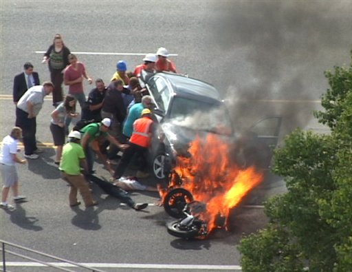 APTOPIX Burning Car Heroes