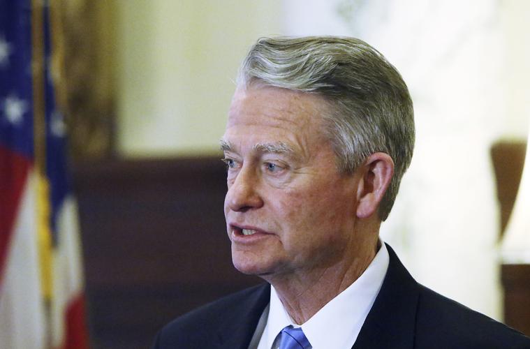 Gov. Brad Little looking left