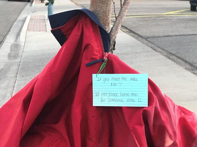 Free coats tied to poles trees