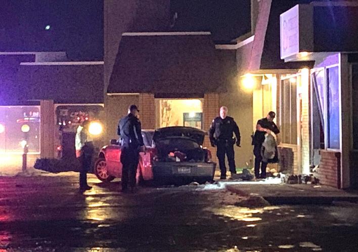 Car crashes into strip mall