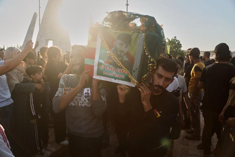 Photos of the funeral for victims of a deadly prison fire and riot in northern Syria