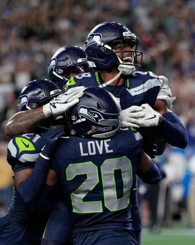 Photos of the NFL season opener, a rare Super Bowl rematch between the Seahawks and Patriots
