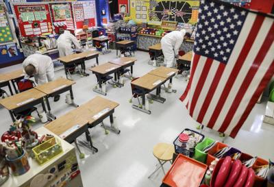 Virus surge: Schools abandon classes, states retreat