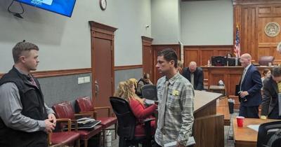 Brad Scott Compher walking out of court