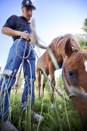 Ryder Wallace with bulldogging horse