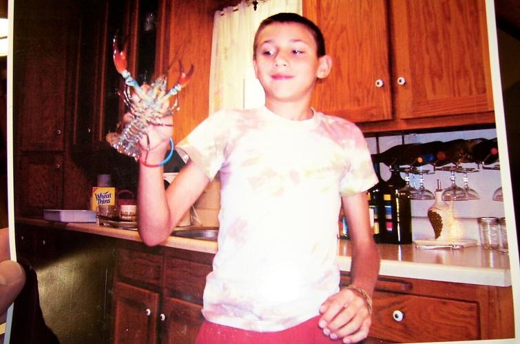 Jake-B-showing-his-huge-crawfish-as-a-kid