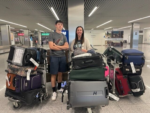 Milligans with suitcases