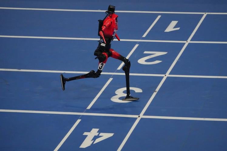 Humanoid robots sprint, play soccer and set records at Beijing games, in photos
