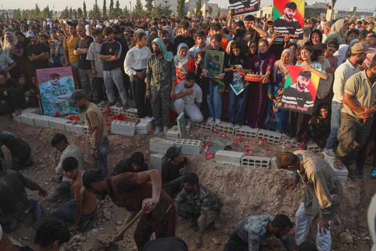 Photos of the funeral for victims of a deadly prison fire and riot in northern Syria