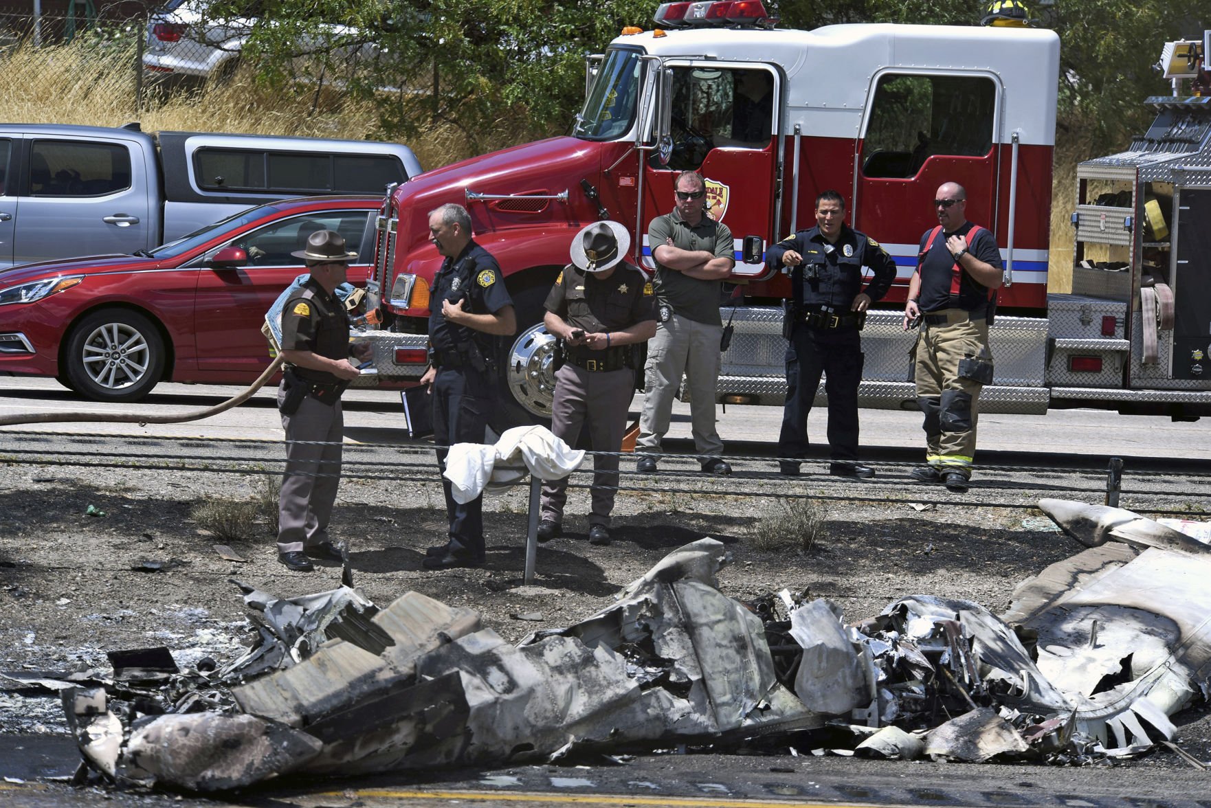 Small plane misses cars but kills 4 aboard in highway crash