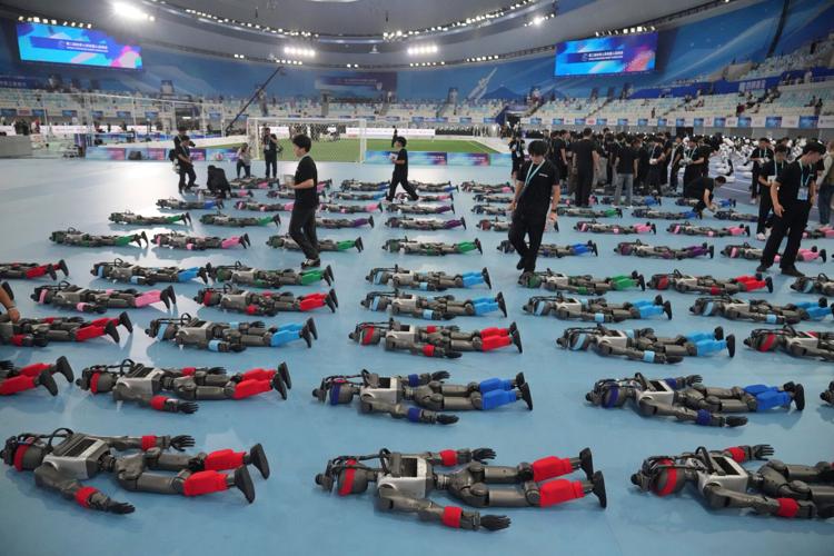 Humanoid robots sprint, play soccer and set records at Beijing games, in photos