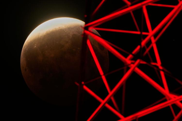 A lunar eclipse lights up skies across the Americas and Europe, in photos