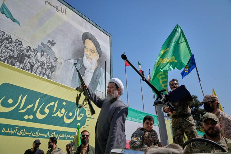Iran stages massive Tehran rally as volunteers pledge to take up arms, in photos