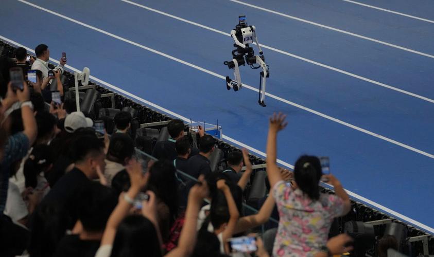 Humanoid robots sprint, play soccer and set records at Beijing games, in photos