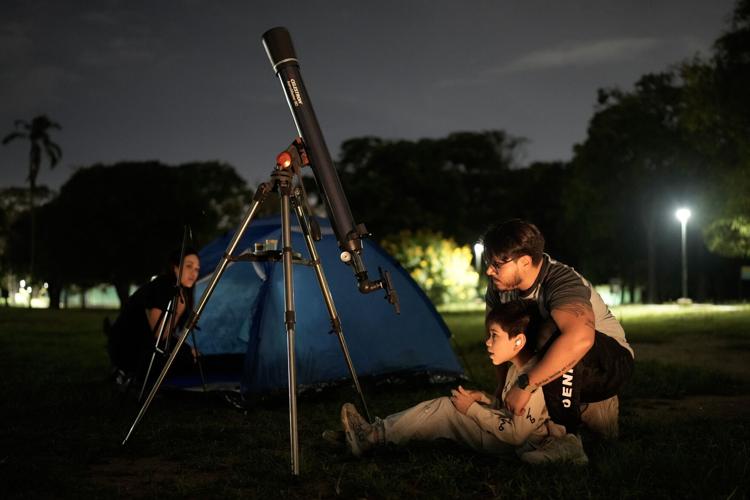 A lunar eclipse lights up skies across the Americas. in photos