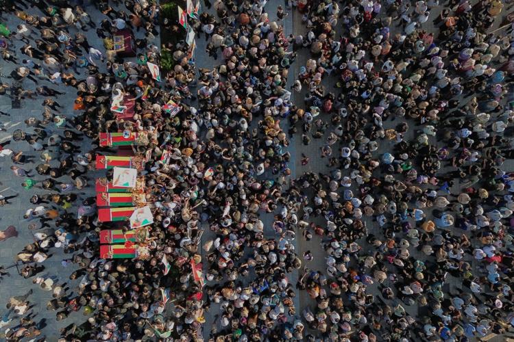Photos of the funeral for victims of a deadly prison fire and riot in northern Syria
